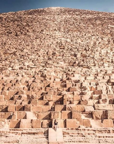 A human sitting in front of the Great Pyramid of Giza... | Great pyramid of giza, Pyramids of ...