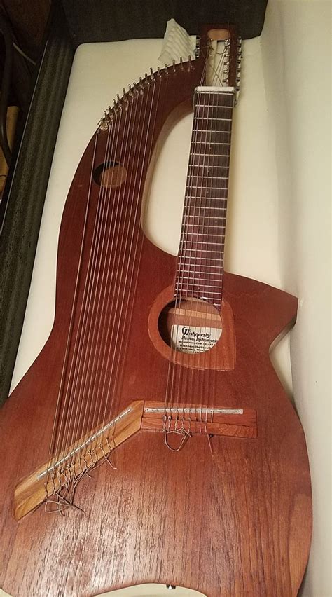 I've recently come into possession of this 22 string harp guitar and I have no idea where to ...