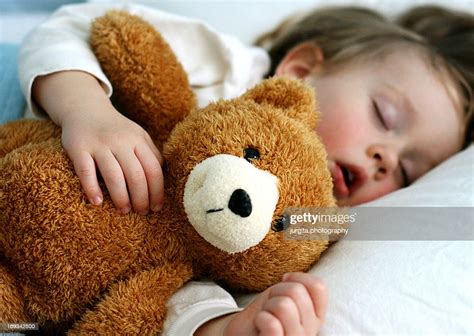 Boy Sleeping With Teddy Bear High-Res Stock Photo - Getty Images