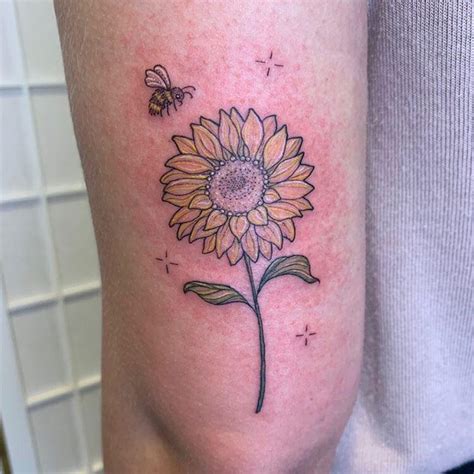 Freshly done sunflower and bee - my first tattoo! Done by Peta ...