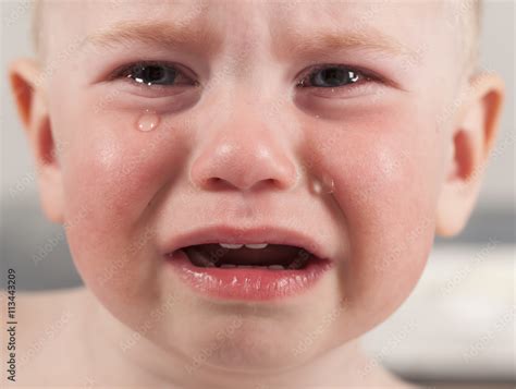 baby crying tears Stock Photo | Adobe Stock