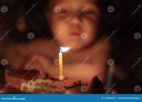 A Kid is Celebrating His Birthday and Blowing Candles on a Baked Cake, Indoor. Birthday Party ...