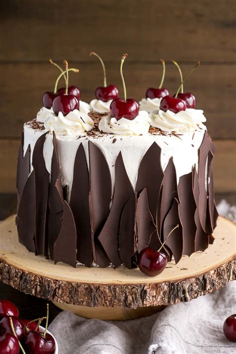 This Black Forest Cake combines rich chocolate cake layers with fresh cherries, cherry liqueur ...