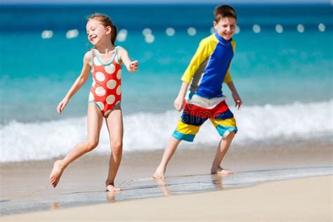 Kids having fun at beach stock image. Image of authentic - 73190499