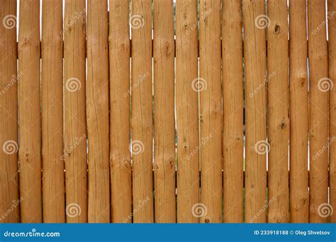 The Fence is Made of Wooden Planks in the Form of a Palisade Stock ...