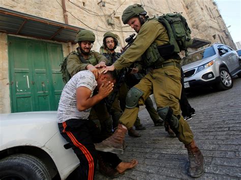 Israeli soldiers photographed beating Palestinian in West Bank | The ...