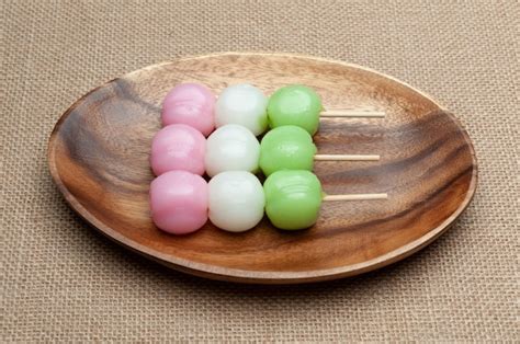 Premium Photo | Japanese traditional sweet called dango mochi on wooden ...