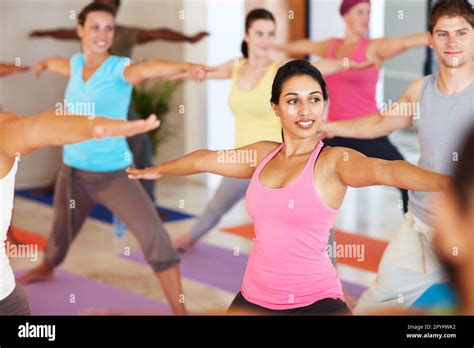 Improving posture and flexibility. A group of people doing a balancing ...