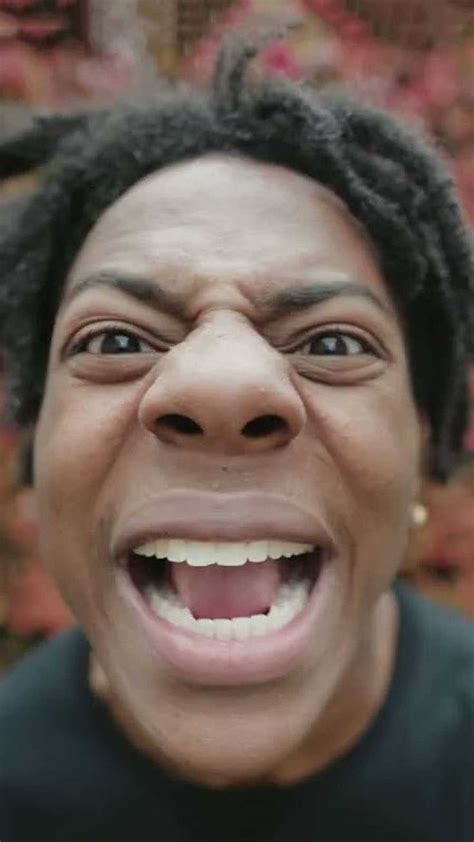 a close up of a person wearing a black shirt and smiling with his mouth ...