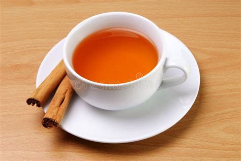 Cup of Tea with Cinnamon Sticks Stock Photo - Image of brown, horizontal: 38408634