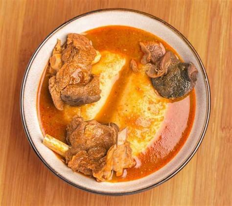 Fufu with light soup and goat meat | Food, African cooking, African food