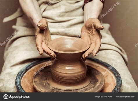 Close up of female hands working on potters wheel Stock Photo by ...