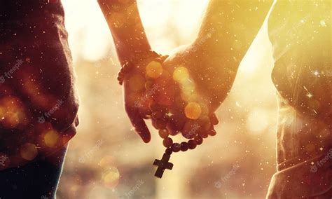 Premium Photo | Couple praying together. Holding rosary in hand.