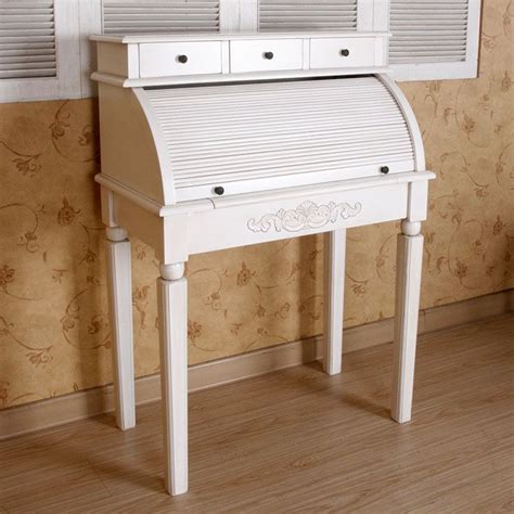 a white desk with drawers on it in front of a wallpapered wall and ...