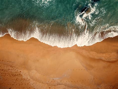 Premium Photo | Beach on aerial drone top view with ocean waves ...