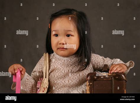 The small Korean girl in studio Stock Photo - Alamy