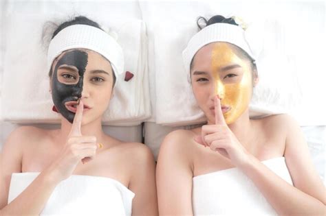 Premium Photo | Couple beautiful and healthy young woman relaxing with face massage skin care ...