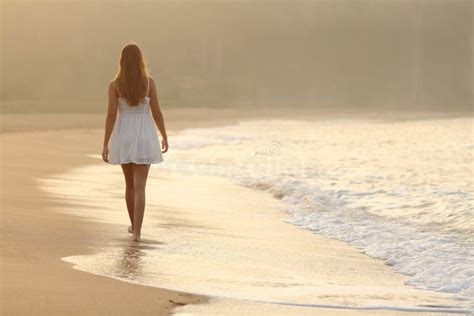 Woman Walking On The Sand Of The Beach Stock Photo - Image: 45764755