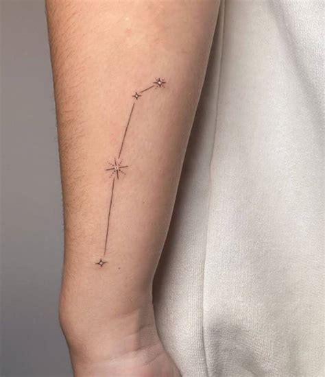 Aries constellation tattoo on Laura Escanes' wrist.