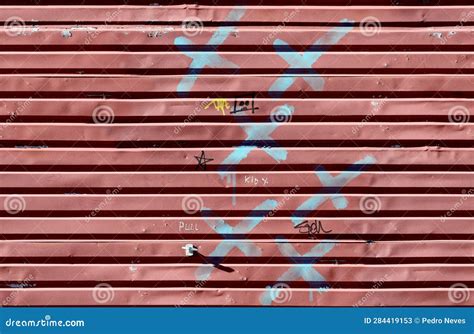 Rolling Sliding Shop Garage Door with Vandalism Sign of Graffiti Blue Spray Paint Stock Image ...