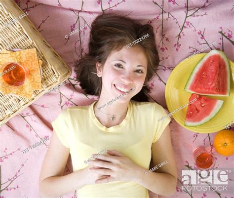 Woman laying on picnic blanket, Stock Photo, Picture And Royalty Free ...