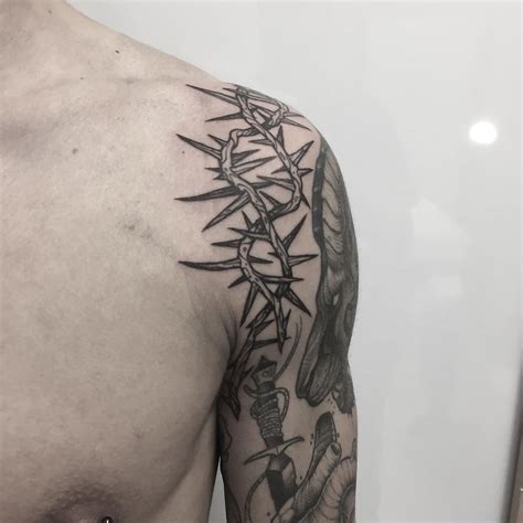 Crown of thorns tattoo on the left shoulder | Thorn tattoo, Tattoos, Cage tattoos
