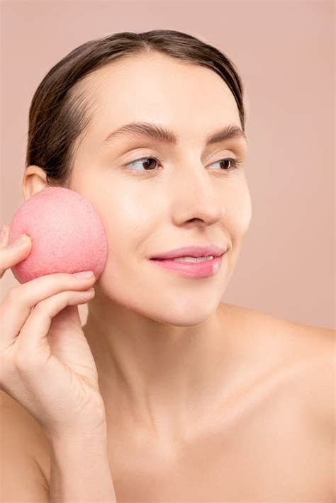 Woman Holding Pink Round Sponge · Free Stock Photo