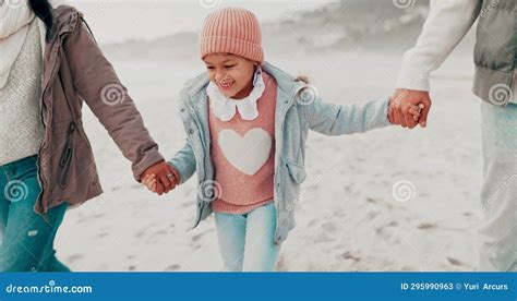 Family, Holding Hands and Happy Girl Child at the Beach with Parents for Vacation, Bond and Fun ...