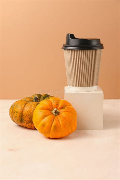 Different Types of Mini Pumpkins on the Geometrical Podium and Craft Coffee Cup on the Top.Spicy ...