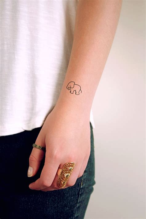 Small elephant temporary tattoo (set of two) | Hand tattoos for women, Small tattoos, Unique ...