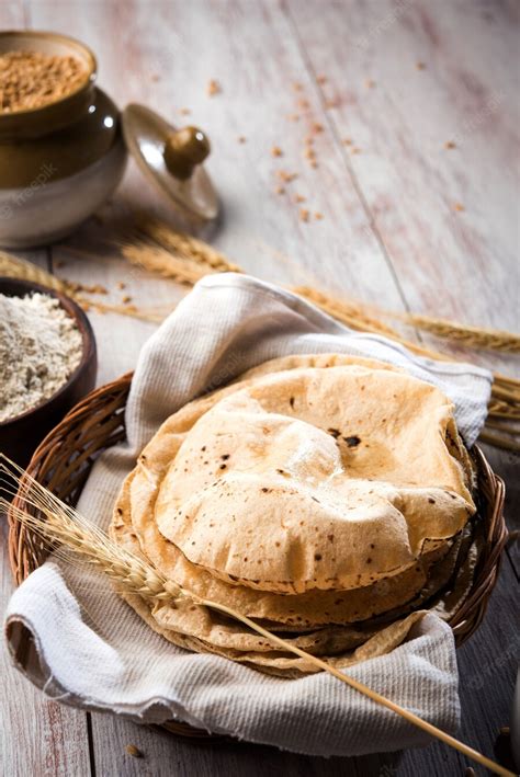 Premium Photo | Indian chapati or fulka or gehu roti with wheat grains ...