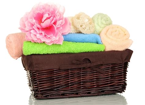 Premium Photo | Bathroom towels folded in wicker basket isolated on white