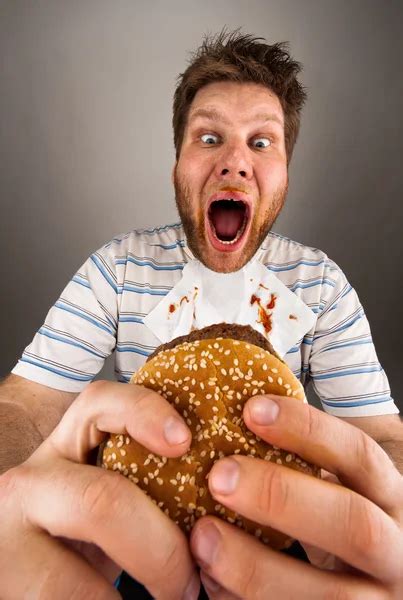 Fat man eating burger — Stock Photo © Nomadsoul1 #5590497