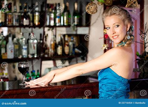 Young Beautiful Woman at a Bar Counter Stock Photo - Image of counter, entertainment: 23716454