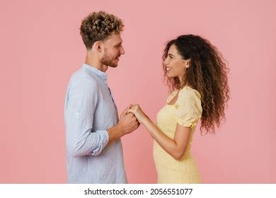 Young White Couple Holding Hands While Stock Photo 2056551077 ...