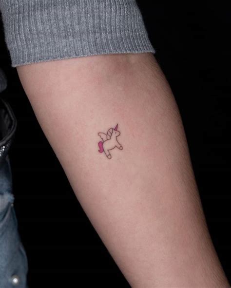 Minimalist unicorn tattoo on the inner forearm