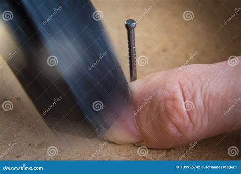 Hammer on thumb stock photo. Image of handyman, improvement - 139996742