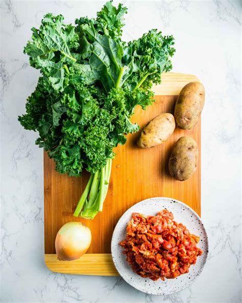 Spicy Sausage Potato and Kale Soup - Sip and Feast