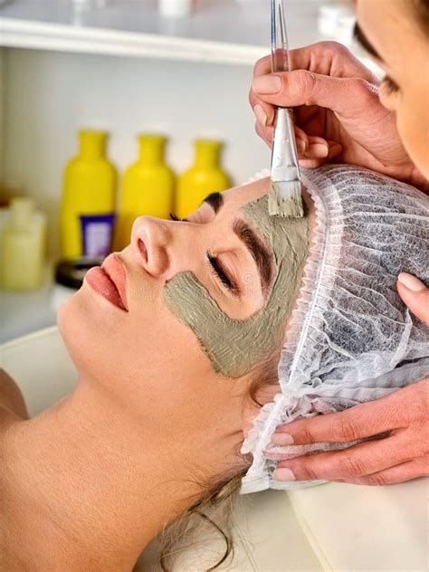 Mud Facial Mask of Woman in Spa Salon. Face Massage . Stock Photo ...