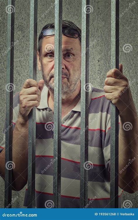 Mature Man Awaiting Release on Bail in a Prison Cell Stock Photo ...