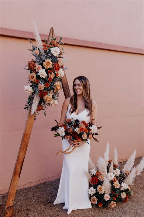 Deep burgundy red blue arch arrangement Arch flowers Fall wedding ...