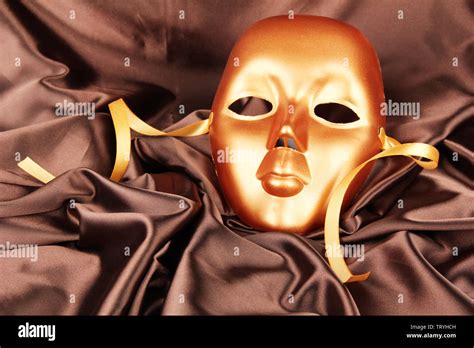 Mask on brown fabric background Stock Photo - Alamy