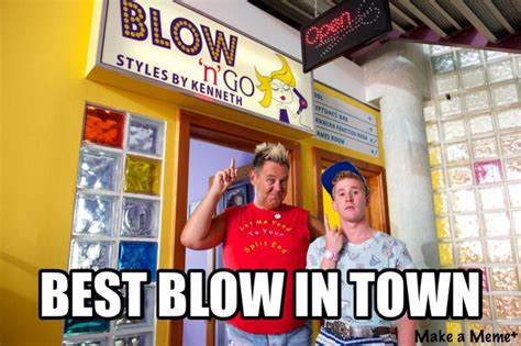 two men standing in front of a building with the words best blow - in town