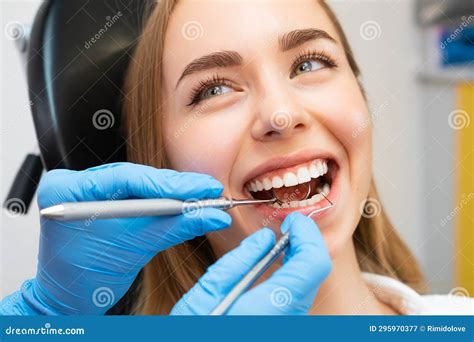 A Patient Sits in the Ergonomic Dental Chair Has Examination of Teeth Stock Image - Image of ...