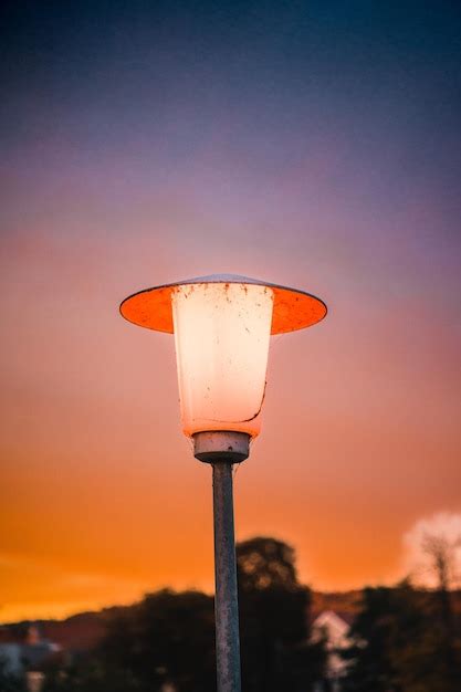 Premium Photo | Lamp post against sunset sky