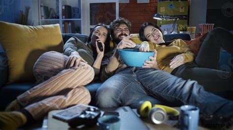 Friends watching movies together at home - stock photo 2157127 | Crushpixel