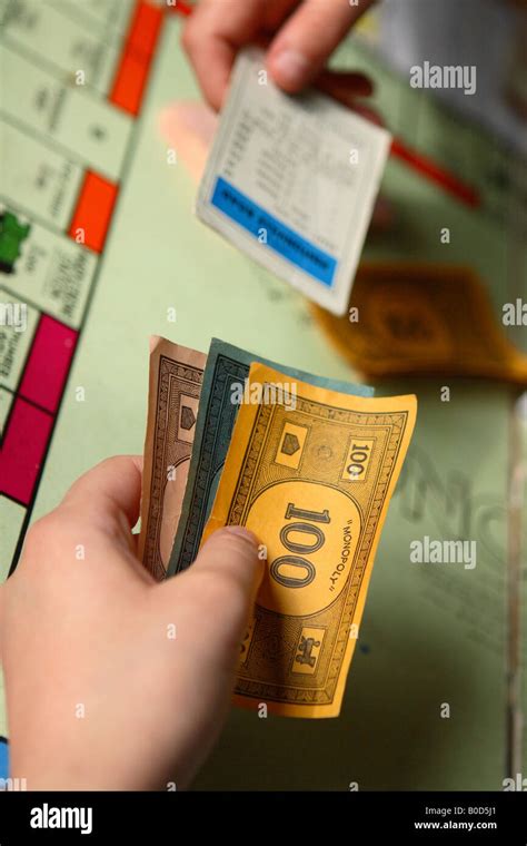 Monopoly board game financial strategy bid barter and exchange property card Stock Photo - Alamy