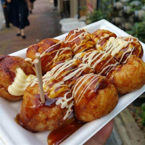 Tokyo Street Food - Takoyaki - Balls of wheat flour stuffed with green ...