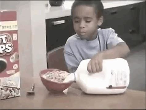 kid fails pouring milk into cereal bowl gif | WiffleGif