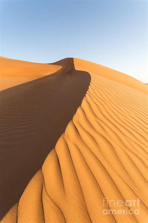 Desert dunes at sunset - Oman Photograph by Matteo Colombo - Pixels